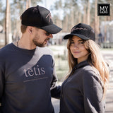 A cap TĒTIS