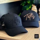 A cap TĒTIS